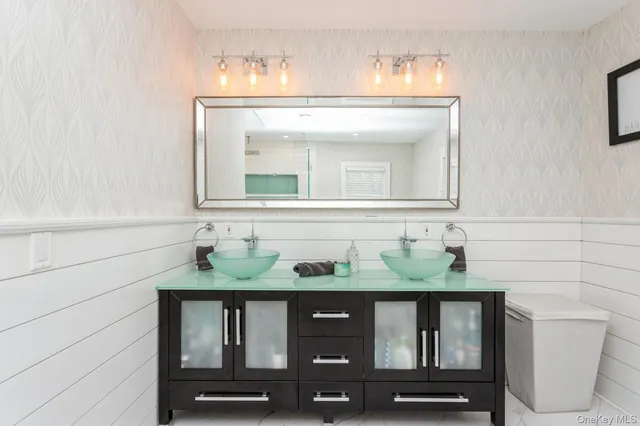 a bathroom with a sink and a mirror