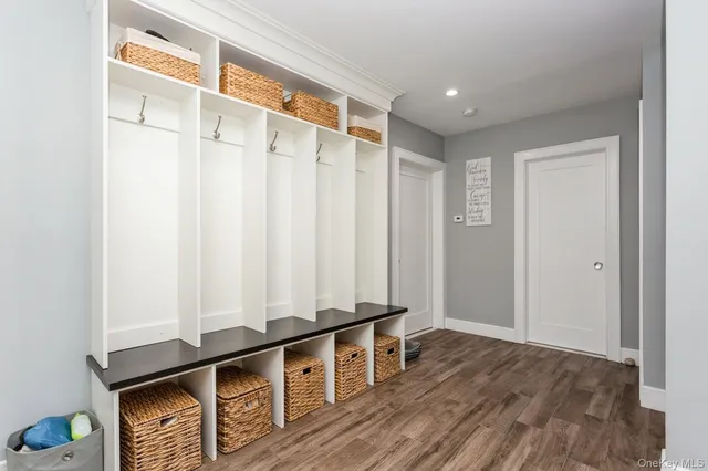 a view of an entryway with wooden floor