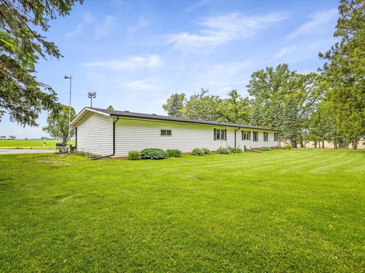 8500 Manchester Road Capron, IL 61012 - Photo 45 of 51 a front view of a house with garden