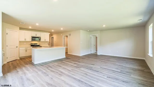 a view of kitchen with wooden floor