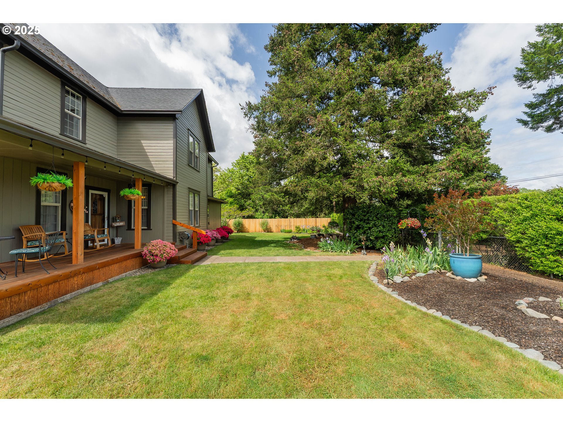 4500 Glenbrook Loop Road Riddle, OR 97469 - Photo 22 of 46 a view of a patio with table and chairs and potted plants