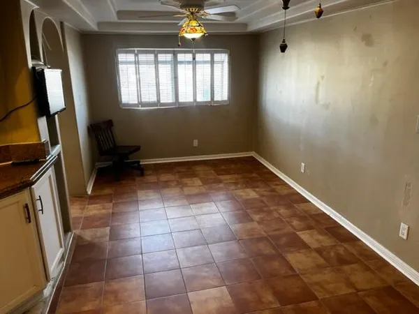 a view of an empty room with a window