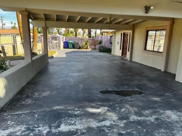 a view of an empty room with a fireplace