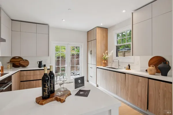 a kitchen with a stove top oven and cabinets
