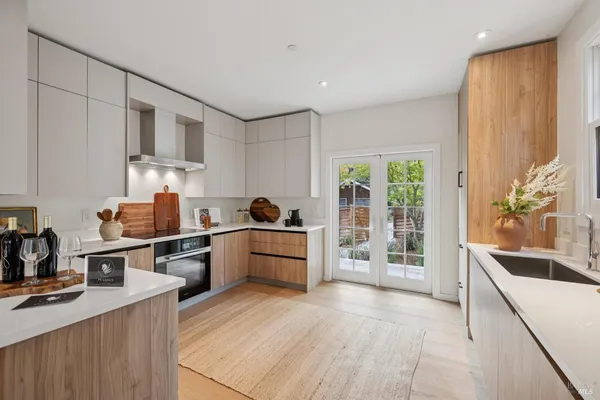 a view of a workspace room with a potted plant and a more windows