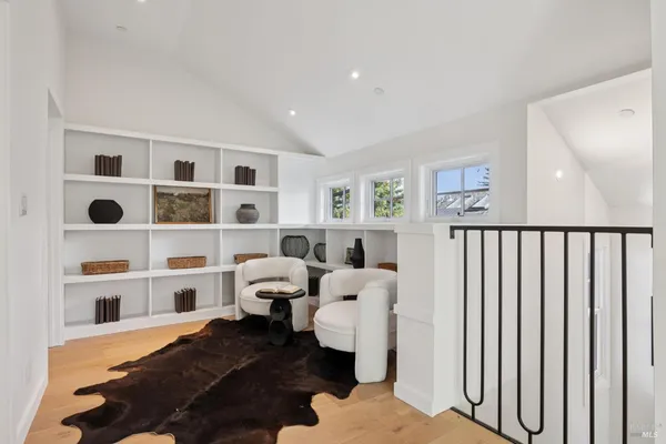 a spacious bedroom with a bed and a window