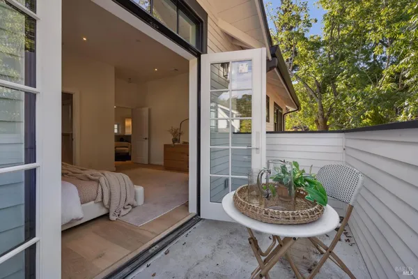 a bedroom with two beds and a window