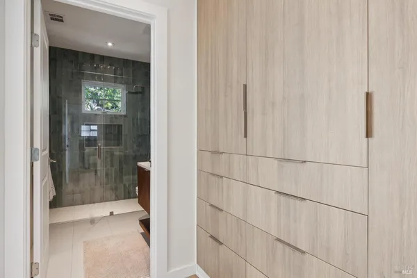 a view of a patio with table and chairs and potted plants