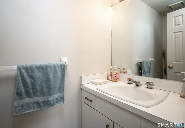 a kitchen that has a stove a table and chairs in it