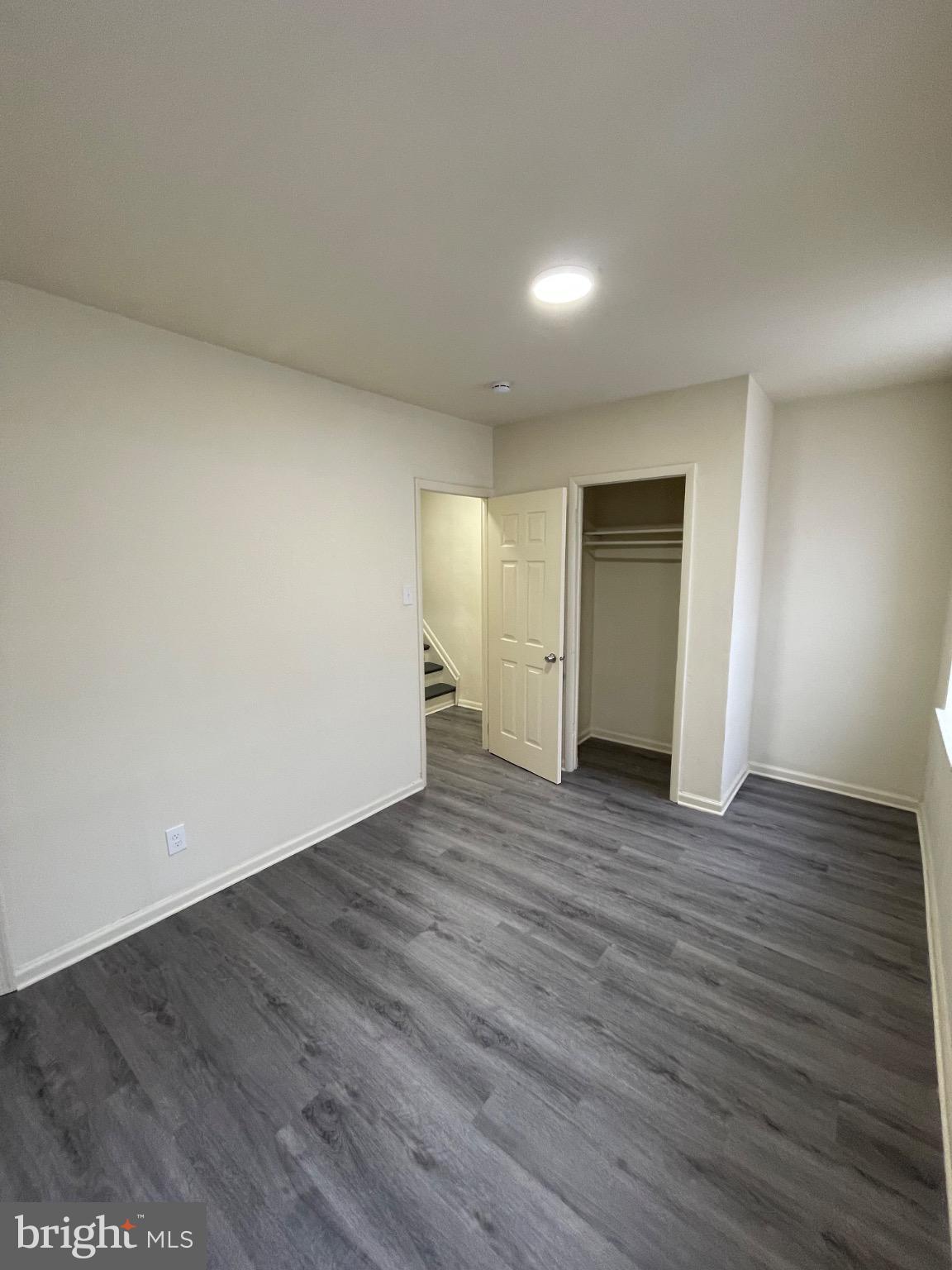 2441 North 5th Street Philadelphia, PA 19133 - Photo 12 of 19 a view of an empty room with wooden floor and closet