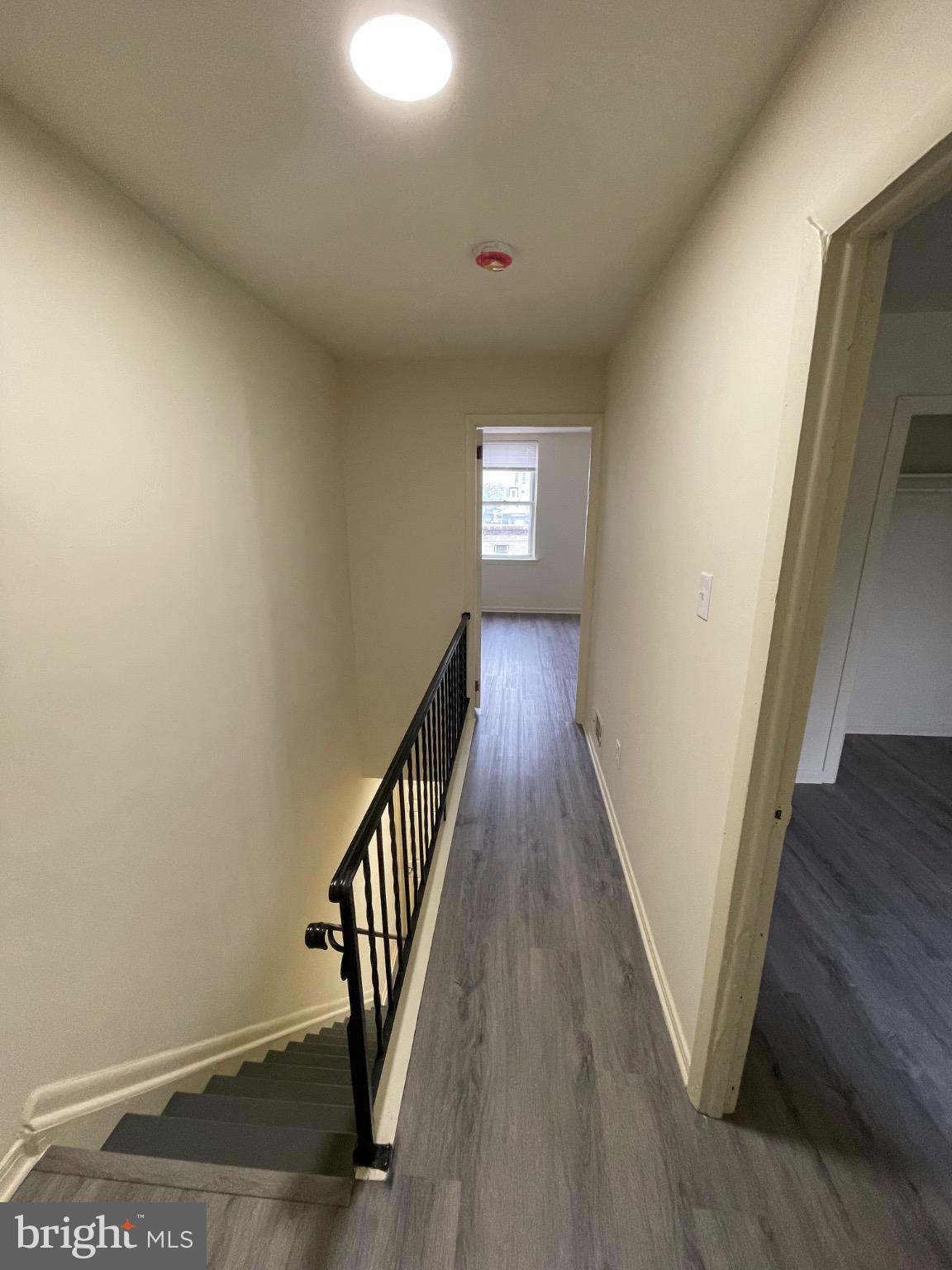 2441 North 5th Street Philadelphia, PA 19133 - Photo 13 of 19 a view of a hallway with wooden floor and staircase