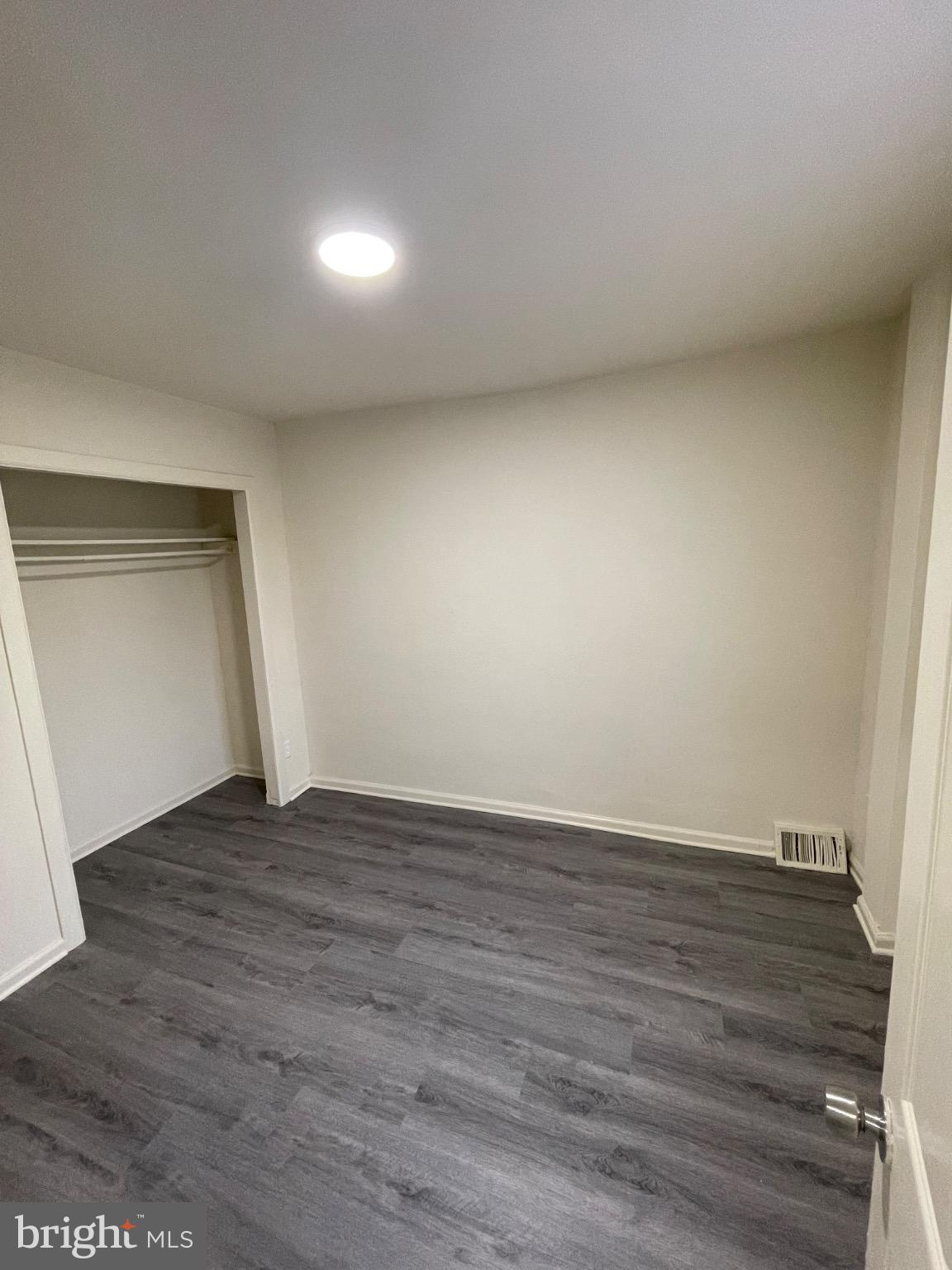 2441 North 5th Street Philadelphia, PA 19133 - Photo 14 of 19 a view of an empty room and wooden floor
