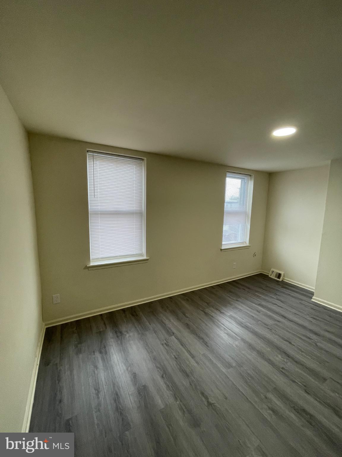 2441 North 5th Street Philadelphia, PA 19133 - Photo 17 of 19 an empty room with wooden floor and windows