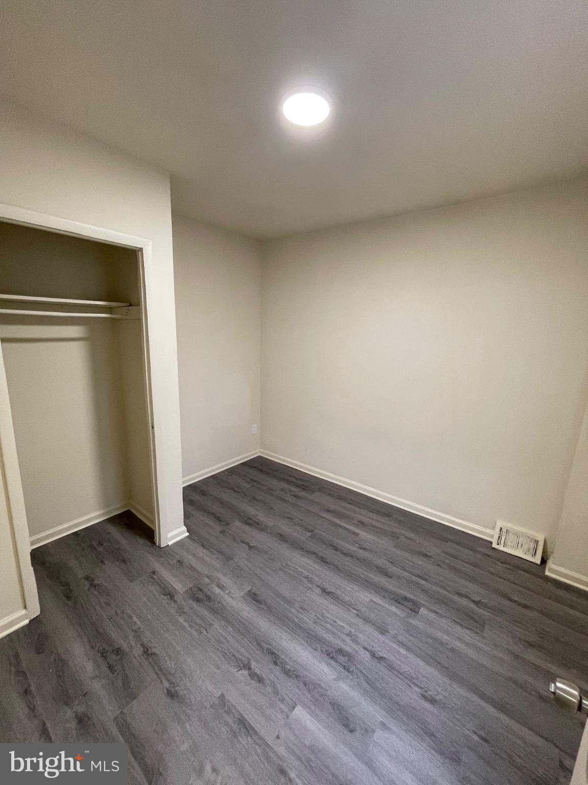 2441 North 5th Street Philadelphia, PA 19133 - Photo 7 of 19 a view of an empty room with wooden floor and closet