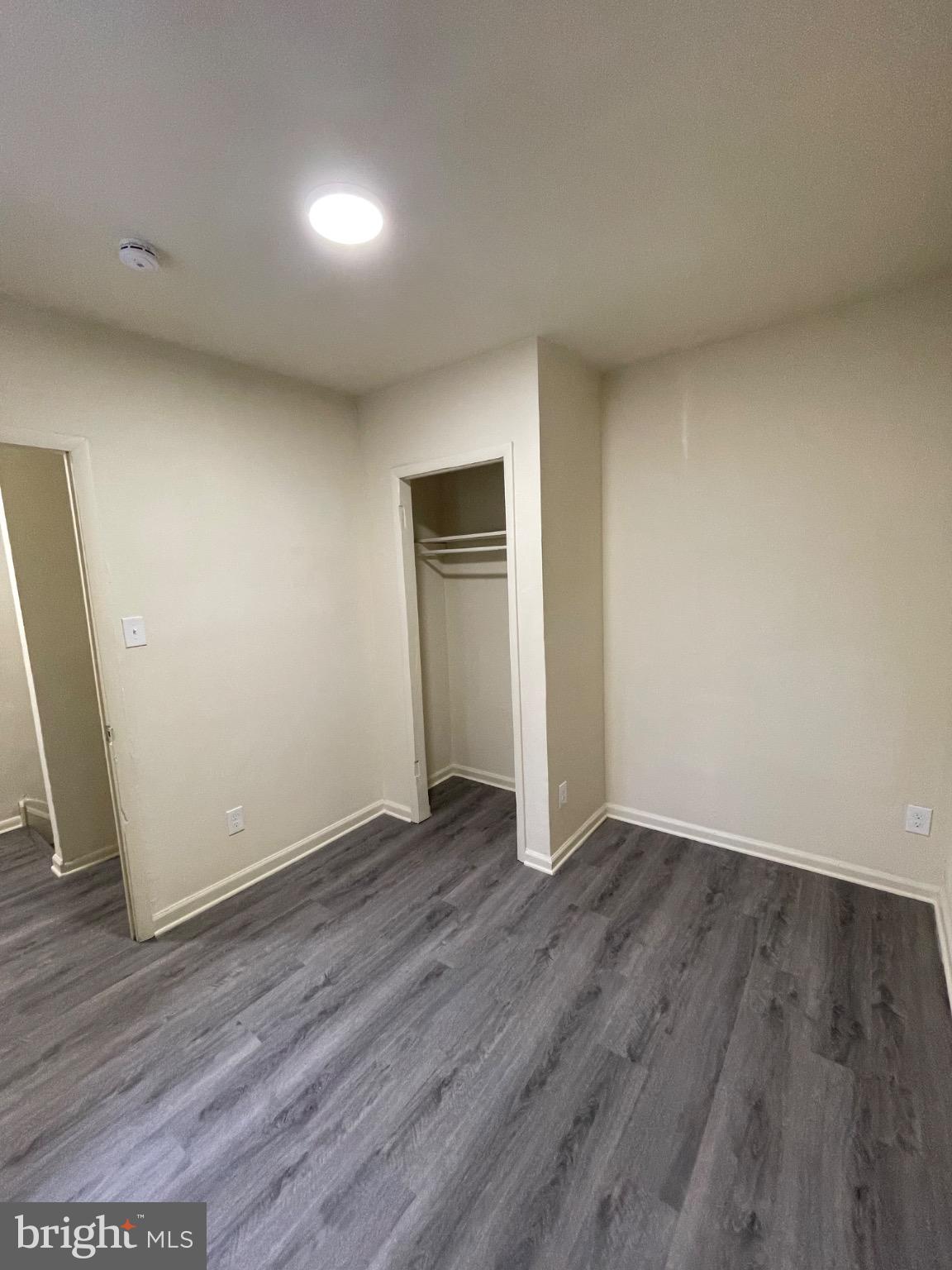 2441 North 5th Street Philadelphia, PA 19133 - Photo 8 of 19 an empty room with wooden floor and closet