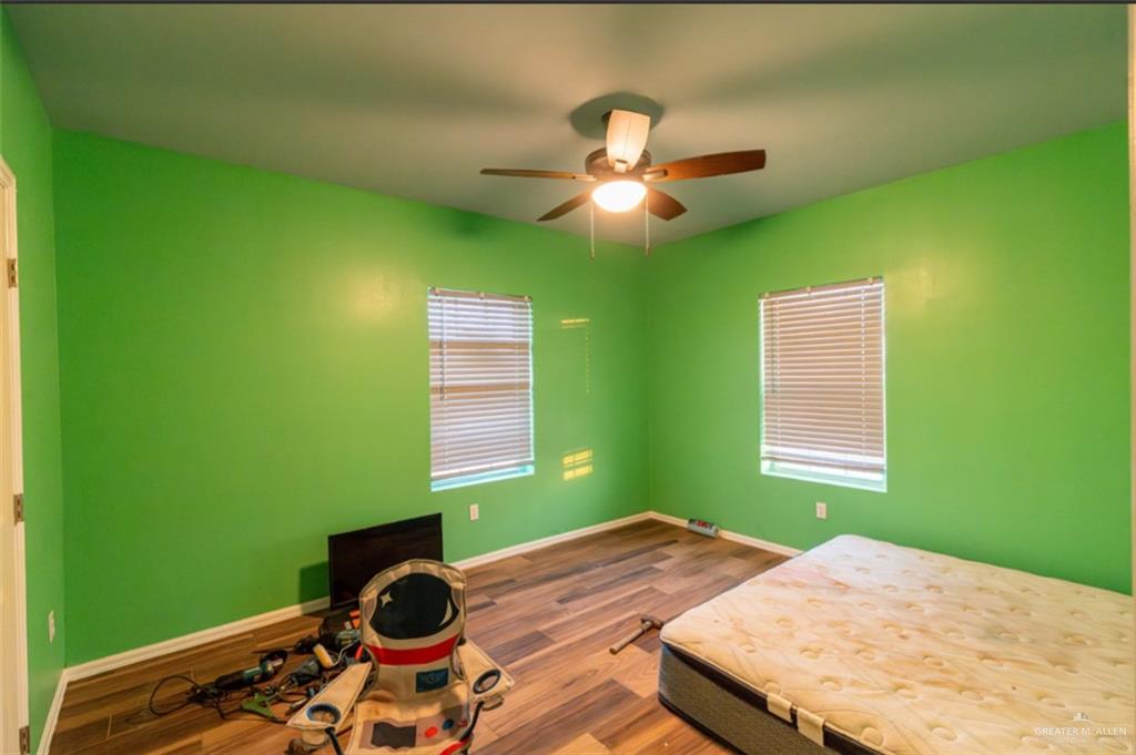4 Mile 4 Road Penitas, TX 78576 - Photo 8 of 12 a bedroom with a bed and a window