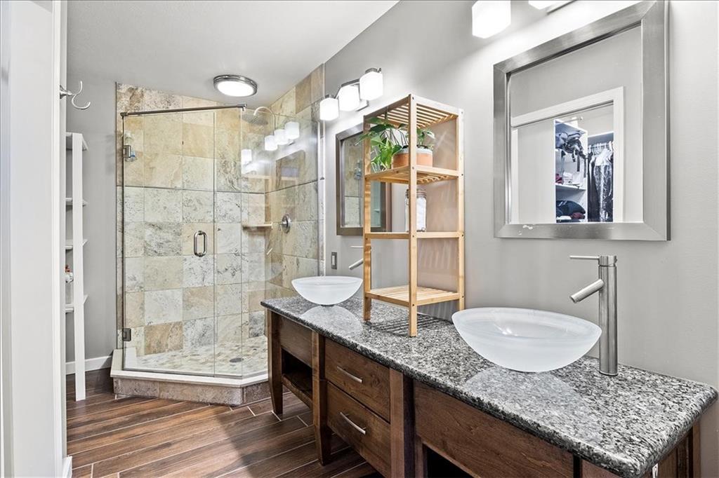 205 Constance Drive McKees Rocks, PA 15136 - Photo 14 of 25 a bathroom with a granite countertop sink a mirror and a shower