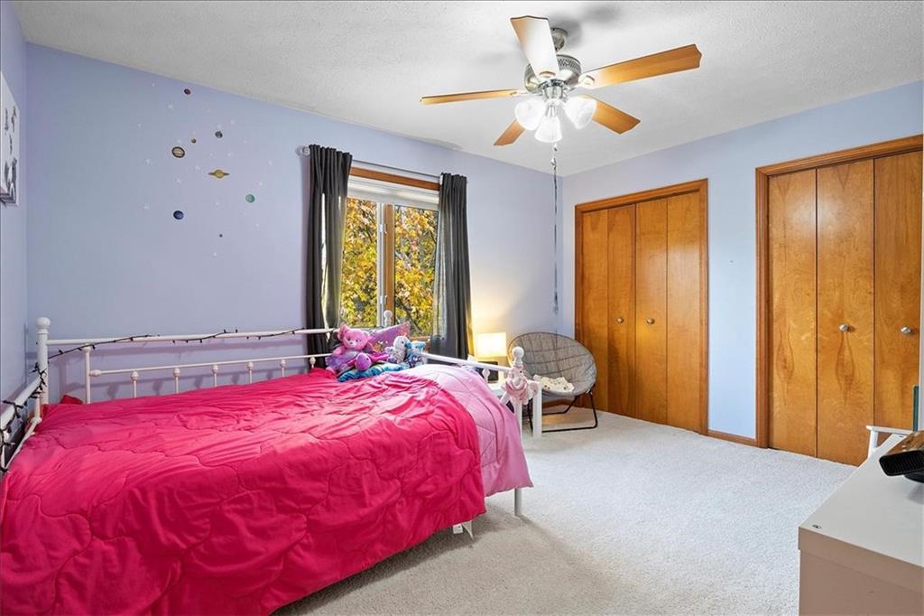 205 Constance Drive McKees Rocks, PA 15136 - Photo 15 of 25 a bed room with a bed and a chandelier