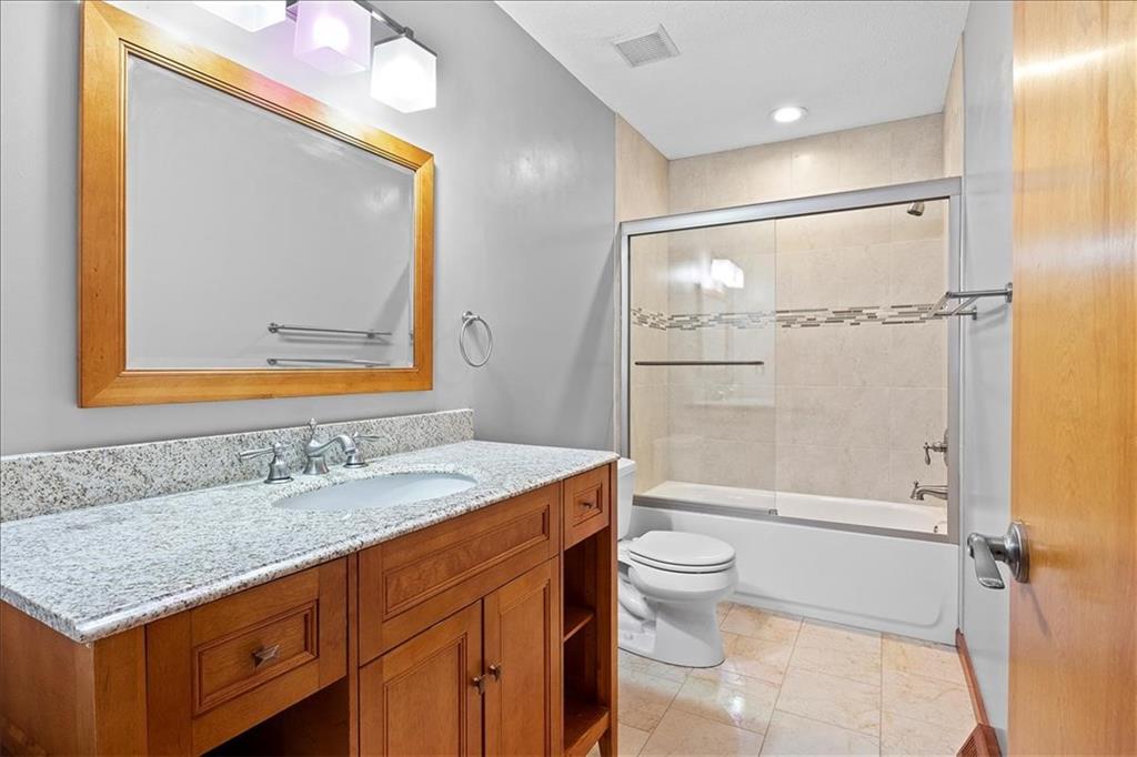 205 Constance Drive McKees Rocks, PA 15136 - Photo 18 of 25 a bathroom with a granite countertop sink toilet and shower