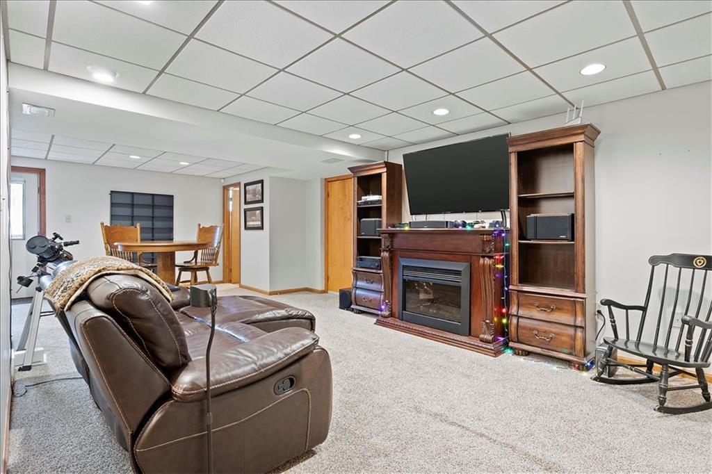 205 Constance Drive McKees Rocks, PA 15136 - Photo 21 of 25 a living room with furniture a flat screen tv and a fireplace