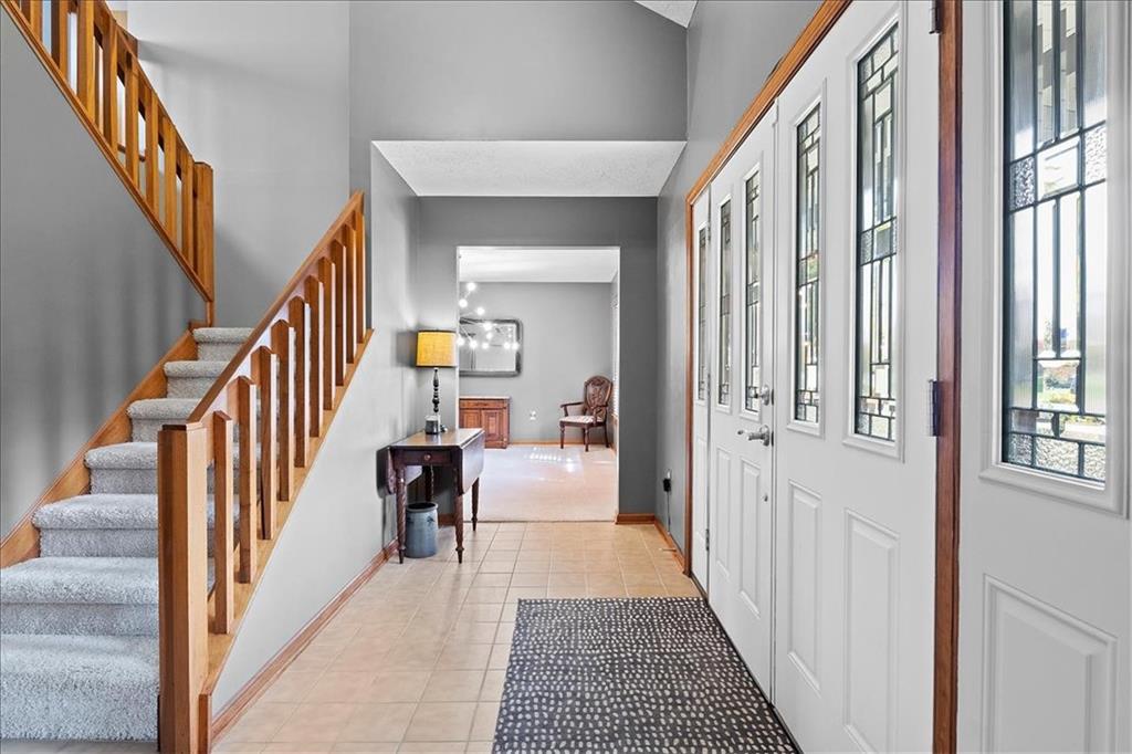 205 Constance Drive McKees Rocks, PA 15136 - Photo 4 of 25 a view of a hallway with wooden floor and staircase