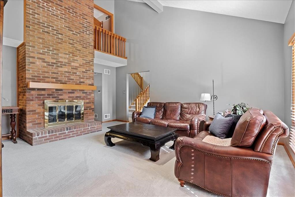 205 Constance Drive McKees Rocks, PA 15136 - Photo 5 of 25 a living room with furniture gym equipment and a fireplace