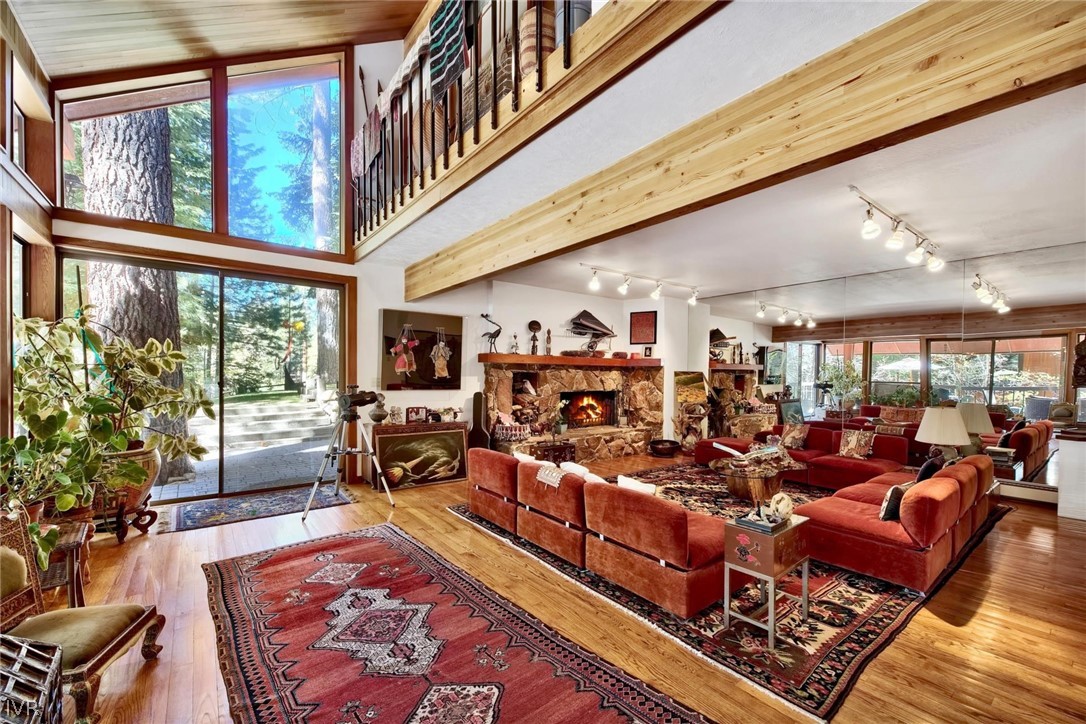 976 Tee Court Incline Village, NV 89451 - Photo 12 of 34 a very nice looking living room with large windows and a rug