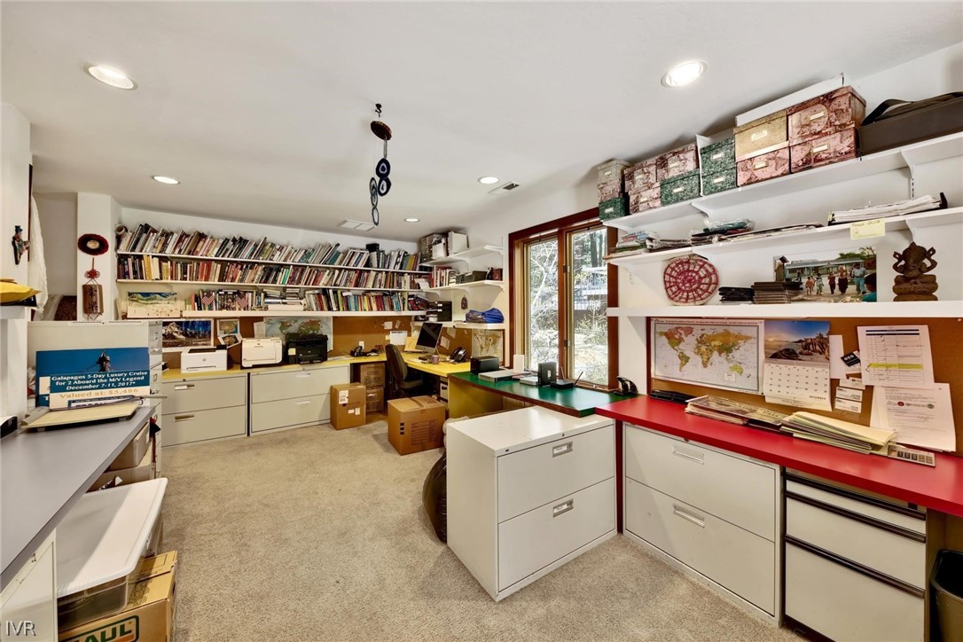 976 Tee Court Incline Village, NV 89451 - Photo 32 of 34 a living room with furniture and a book shelf