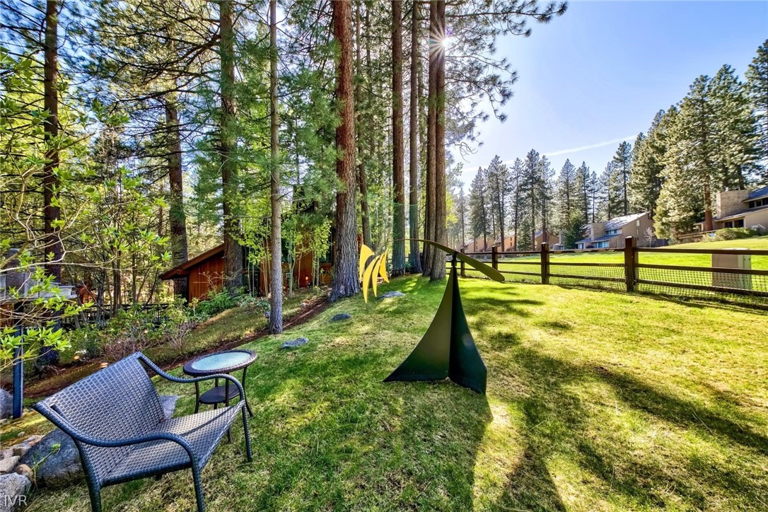 976 Tee Court Incline Village, NV 89451 - Photo 5 of 34 a view of swimming pool with lawn chairs and a fire pit