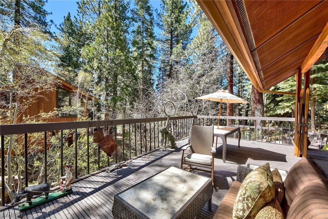 976 Tee Court Incline Village, NV 89451 - Photo 9 of 34 a view of balcony with chairs and wooden floor