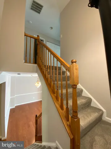 a spacious bathroom with a toilet sink and mirror