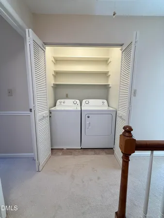 a view of a livingroom with a ceiling fan and window