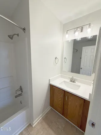 a view of a livingroom with a ceiling fan and window