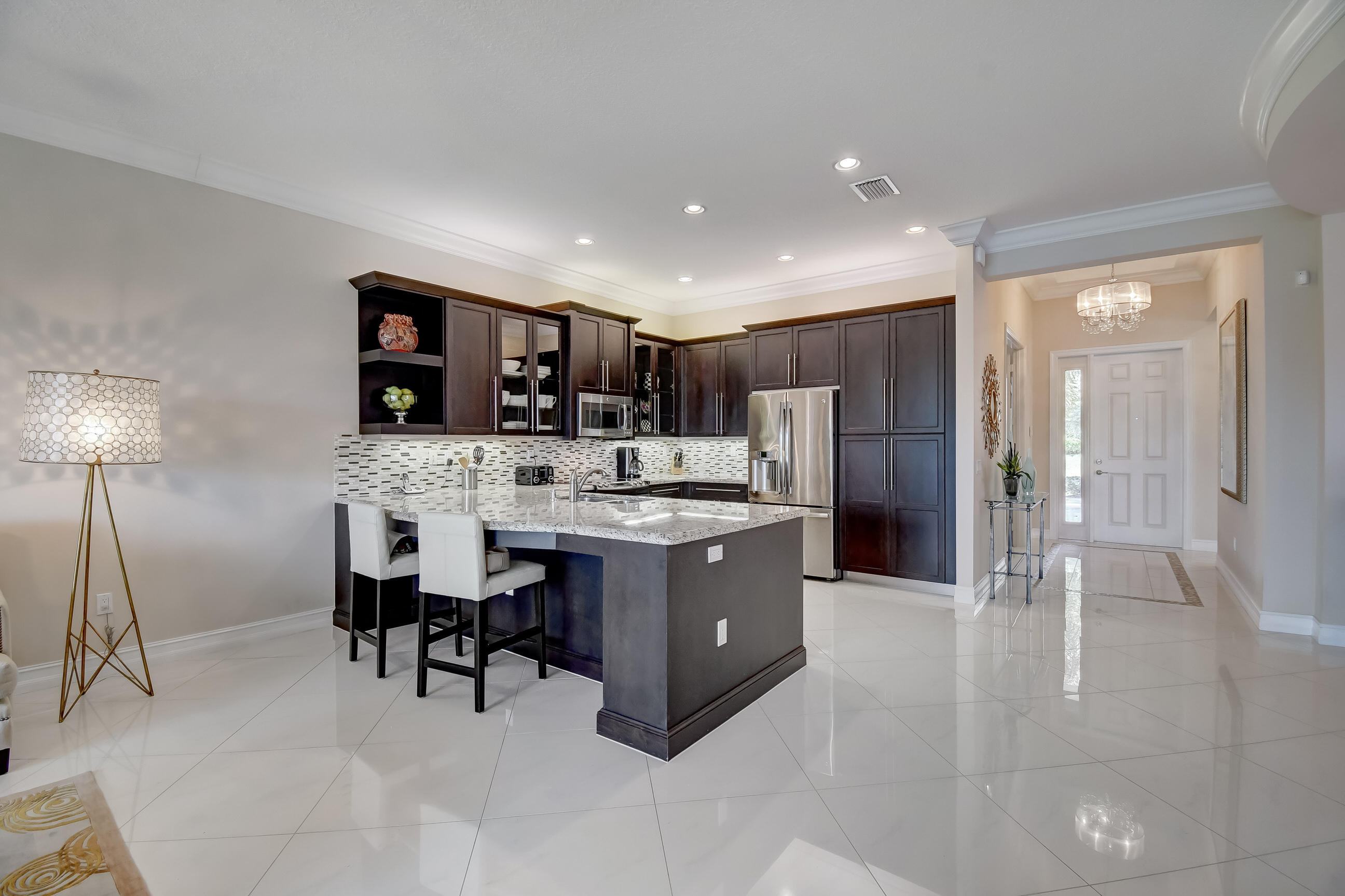 9109 Clearhill Road Boynton Beach, FL 33473 - Photo 7 of 38 another kitchen with back chair