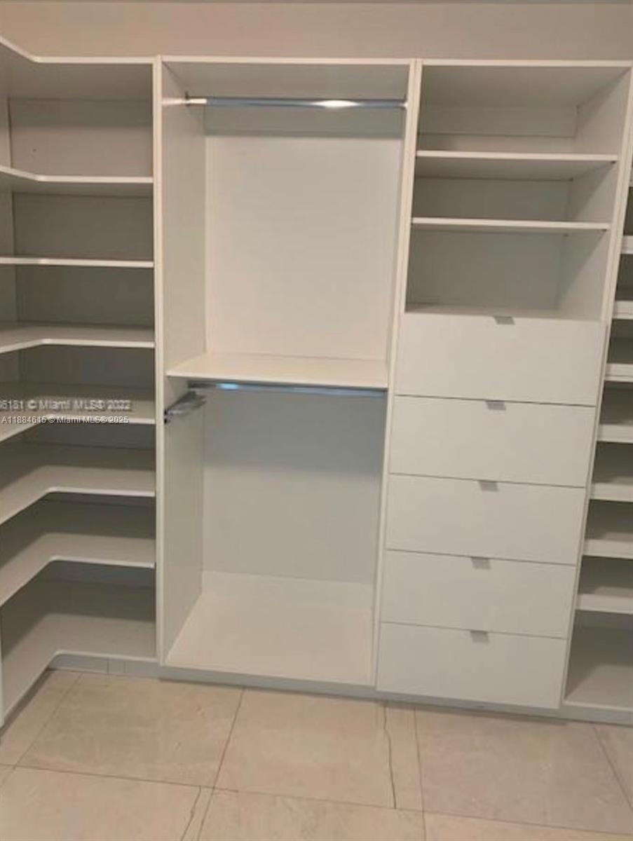 Key Biscayne Key Biscayne, FL 33149 - Photo 11 of 17 a view of walk in closet with empty racks