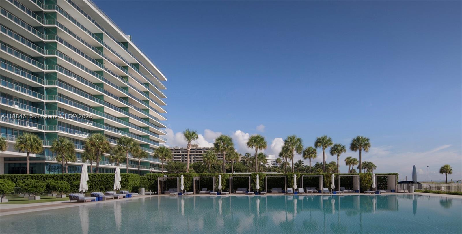 Key Biscayne Key Biscayne, FL 33149 - Photo 15 of 17 a view of a large building with a lake view