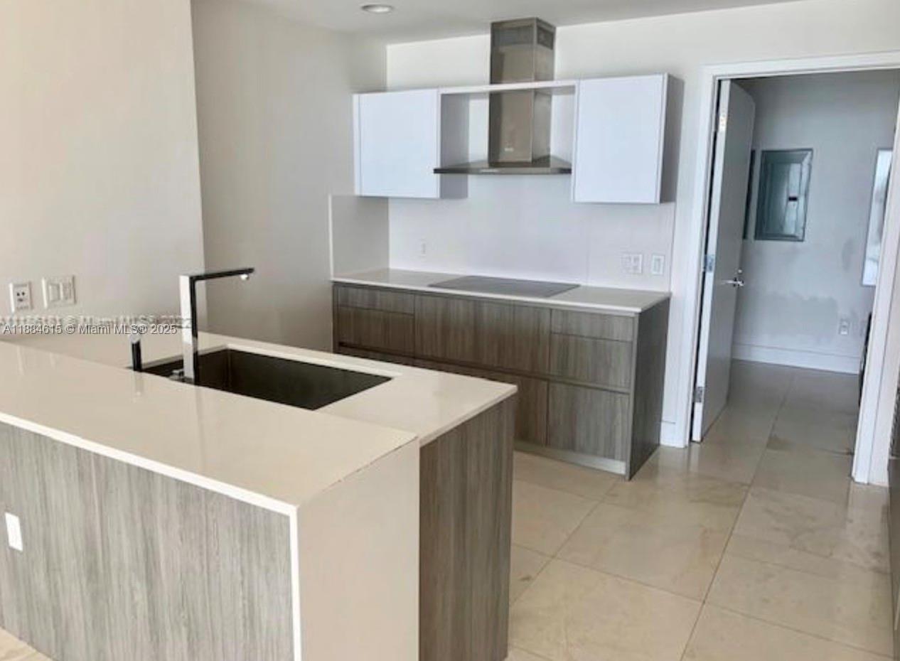Key Biscayne Key Biscayne, FL 33149 - Photo 4 of 17 a kitchen with a sink cabinets and stainless steel appliances