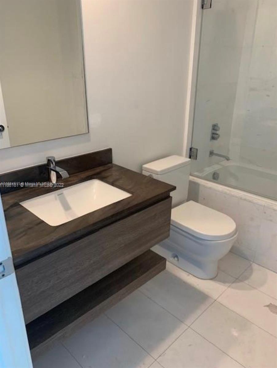 Key Biscayne Key Biscayne, FL 33149 - Photo 7 of 17 a bathroom with a sink vanity mirror and toilet