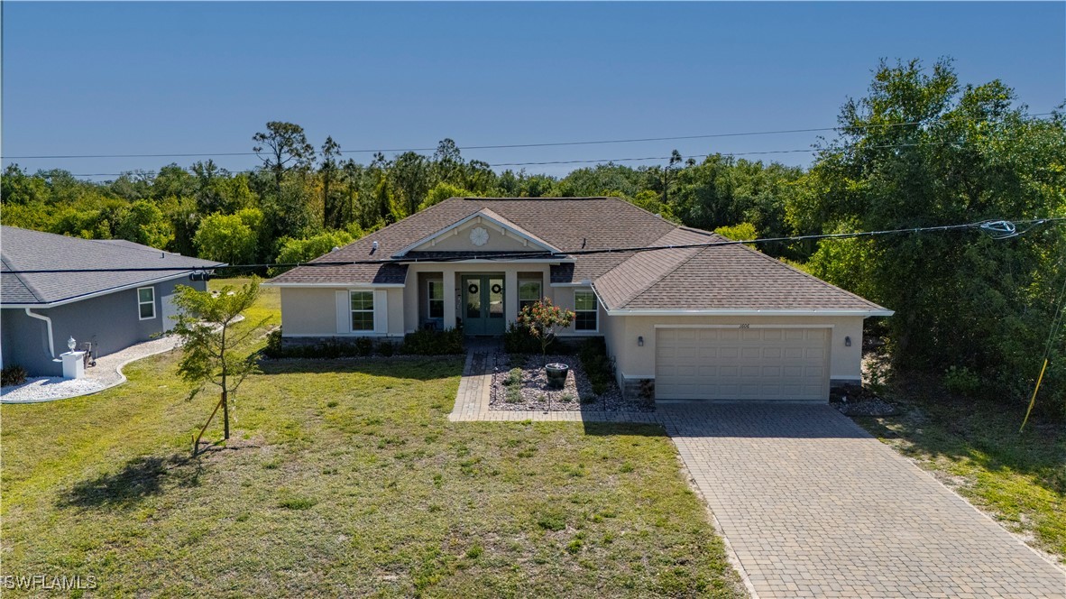 1606 Navigator Road Punta Gorda, FL 33983 - Photo 1 of 47 a front view of a house with a yard
