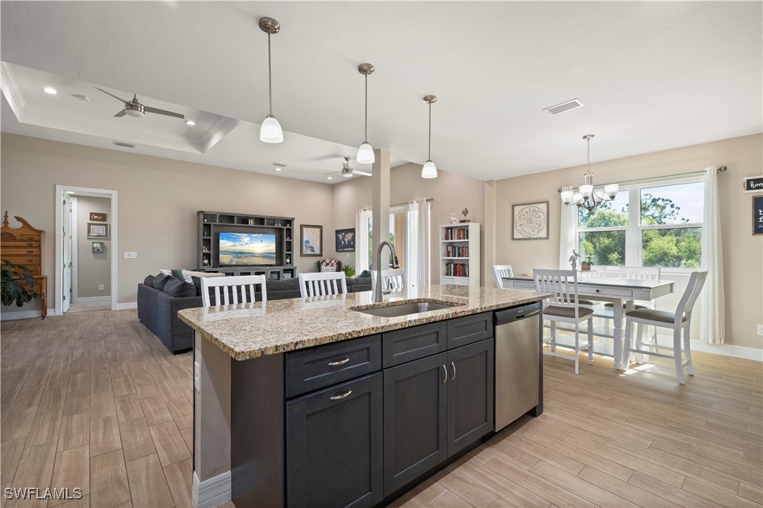 1606 Navigator Road Punta Gorda, FL 33983 - Photo 15 of 47 a kitchen with granite countertop a sink a counter space and stainless steel appliances