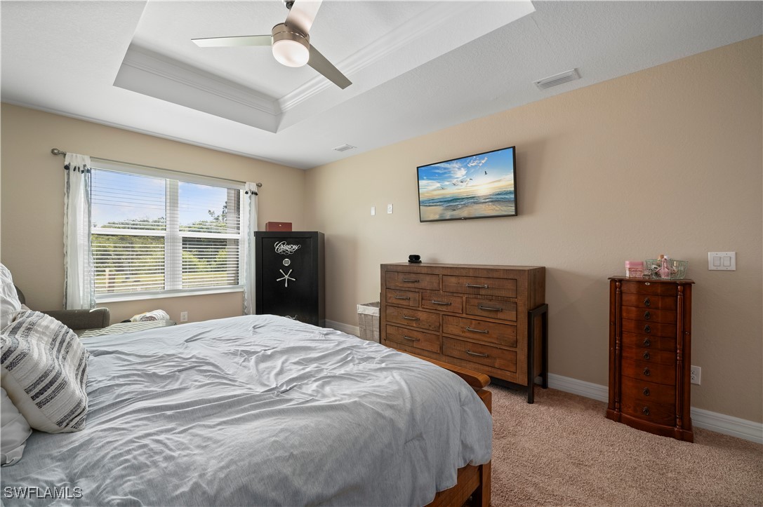 1606 Navigator Road Punta Gorda, FL 33983 - Photo 19 of 47 a bedroom with a bed and a television