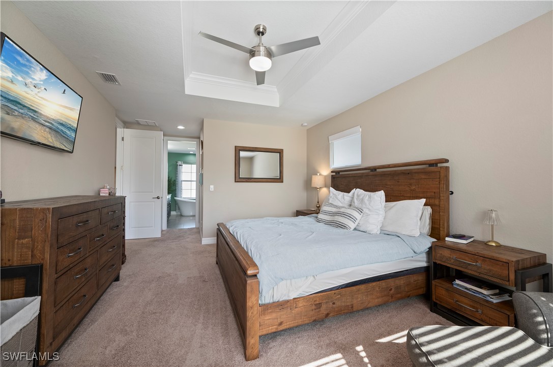 1606 Navigator Road Punta Gorda, FL 33983 - Photo 20 of 47 a bedroom with a large bed and a dresser