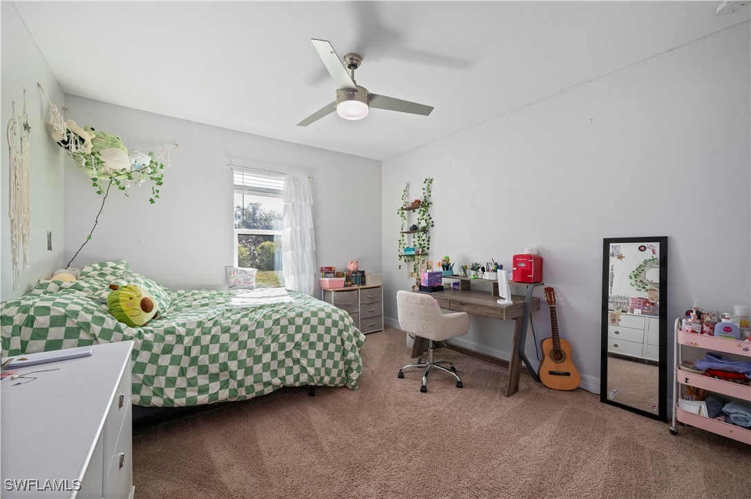 1606 Navigator Road Punta Gorda, FL 33983 - Photo 25 of 47 a bedroom with furniture and a bed