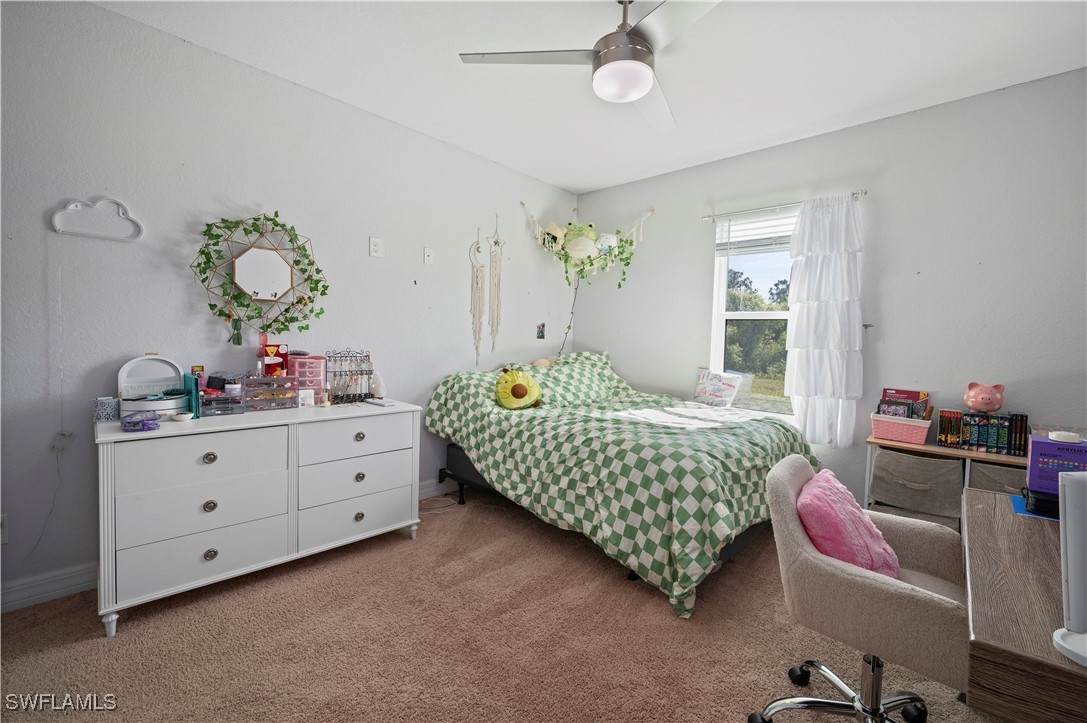1606 Navigator Road Punta Gorda, FL 33983 - Photo 26 of 47 a bedroom with a bed and a dresser