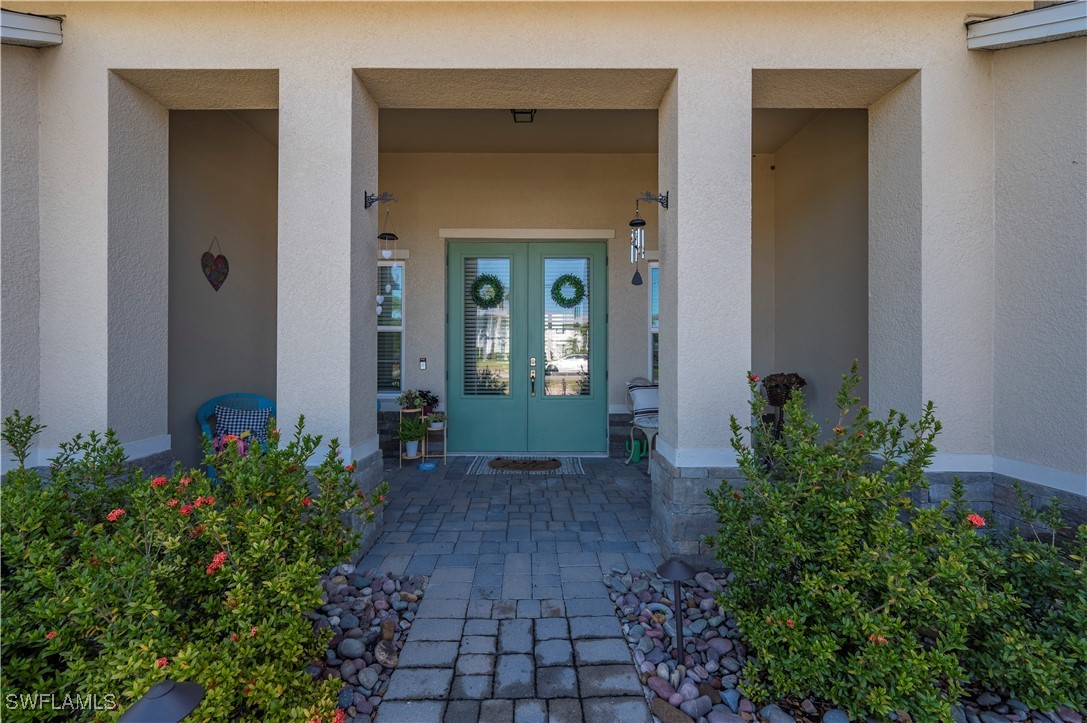 1606 Navigator Road Punta Gorda, FL 33983 - Photo 3 of 47 front view of a house with a yard