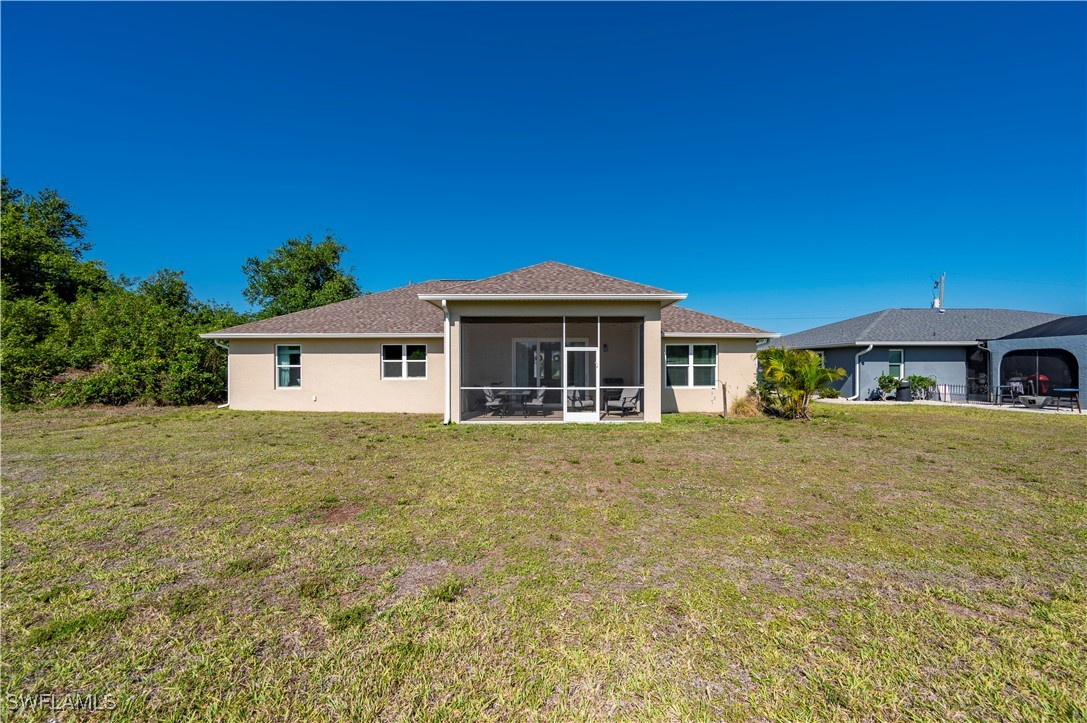 1606 Navigator Road Punta Gorda, FL 33983 - Photo 31 of 47 a front view of a house with a garden