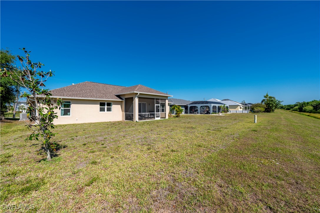 1606 Navigator Road Punta Gorda, FL 33983 - Photo 32 of 47 a front view of a house with a yard
