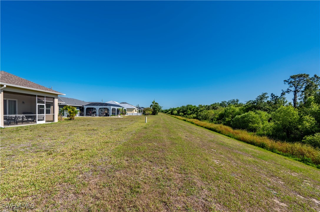 1606 Navigator Road Punta Gorda, FL 33983 - Photo 33 of 47 a view of a house with a yard