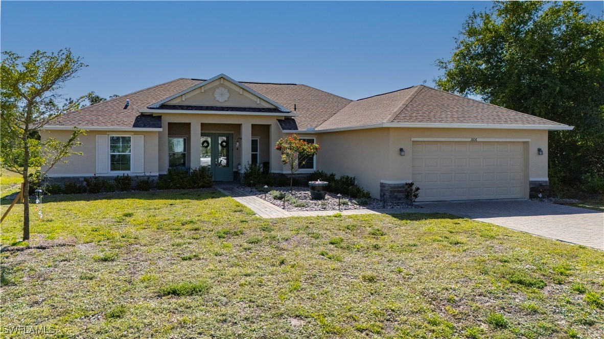 1606 Navigator Road Punta Gorda, FL 33983 - Photo 35 of 47 a front view of a house with a yard