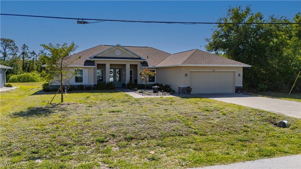1606 Navigator Road Punta Gorda, FL 33983 - Photo 36 of 47 a front view of a house with a yard